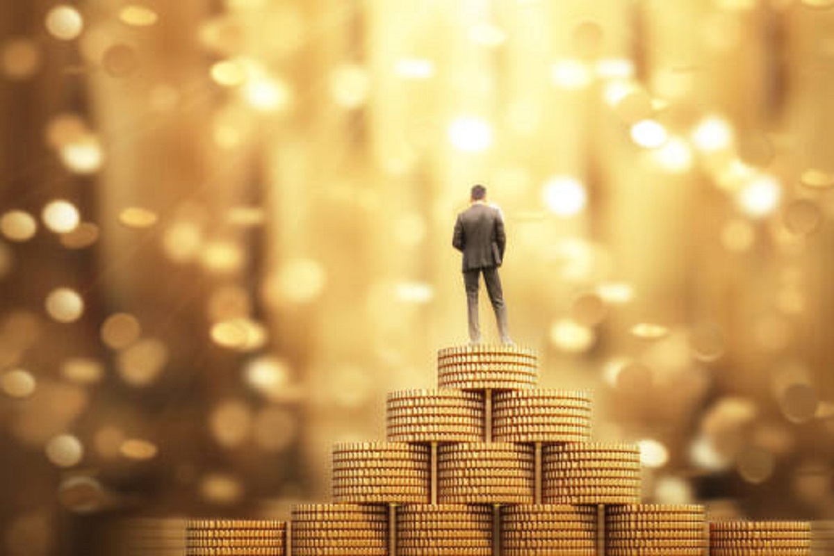 Businessman Standing on Money coins 